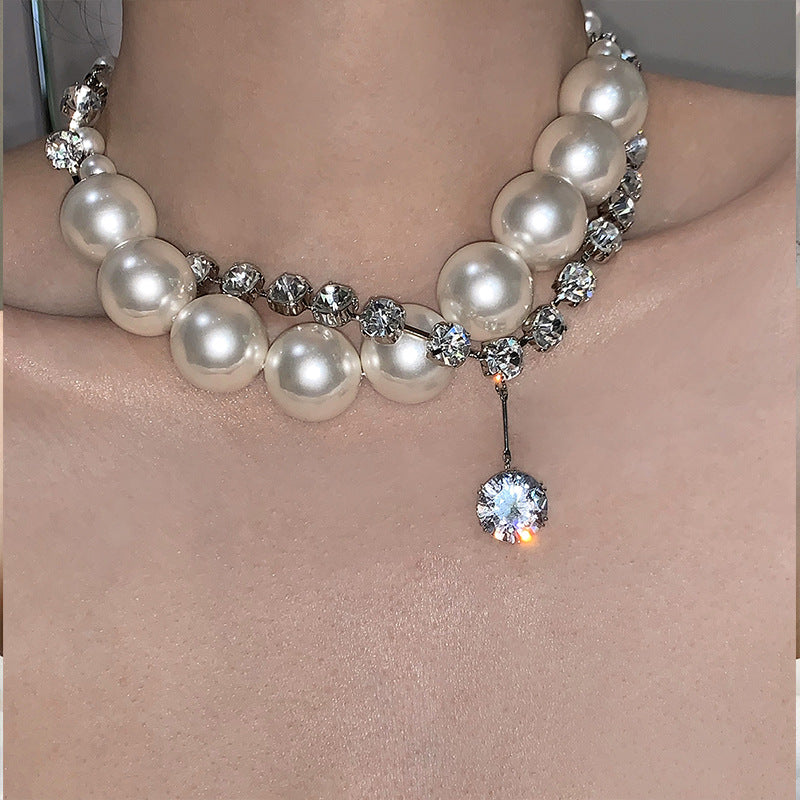 Collana multiuso in zirconi avvolti da perle grandi e piccole